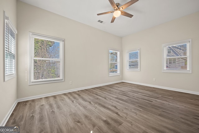 556 James P Brawley Dr NW, Atlanta, GA 30318 - spare room featuring ceiling fan and wood finished floors