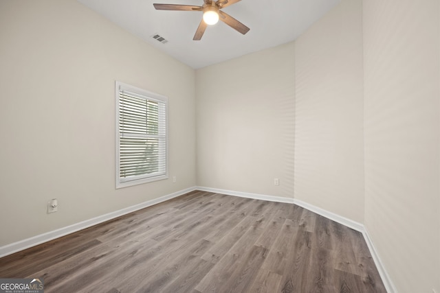 556 James P Brawley Dr NW, Atlanta, GA 30318 - empty room featuring a ceiling fan and wood finished floors