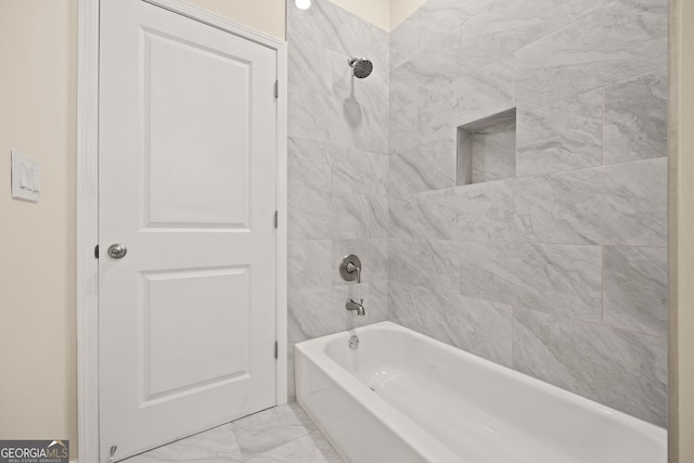 556 James P Brawley Dr NW, Atlanta, GA 30318 - bathroom featuring marble look tile flooring and bathing tub / shower combination