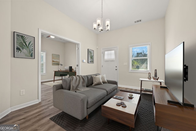 556 James P Brawley Dr NW, Atlanta, GA 30318 - living area featuring a chandelier, wood finished floors, and a desk