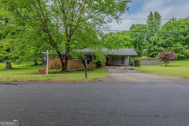 210 Briarwood Dr, Dallas, GA 30132 - view of front facade featuring asphalt driveway, a front yard, and a carport