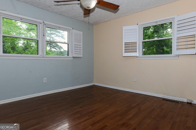 210 Briarwood Dr, Dallas, GA 30132 - unfurnished room with a ceiling fan, baseboards, wood-type flooring, and a textured ceiling