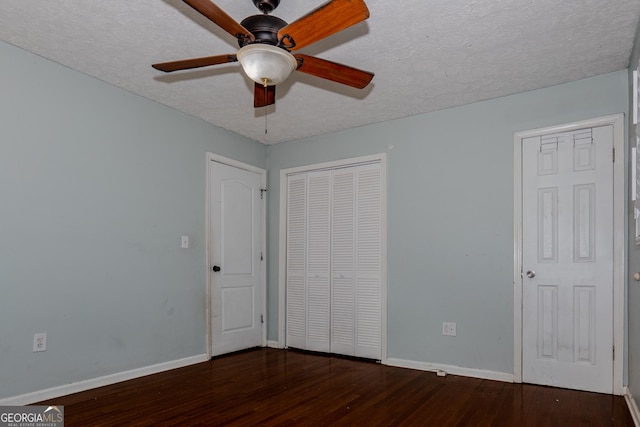 210 Briarwood Dr, Dallas, GA 30132 - unfurnished bedroom with hardwood / wood-style flooring, baseboards, a textured ceiling, and a ceiling fan