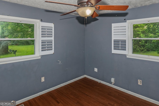 210 Briarwood Dr, Dallas, GA 30132 - empty room featuring wood finished floors, baseboards, and ceiling fan