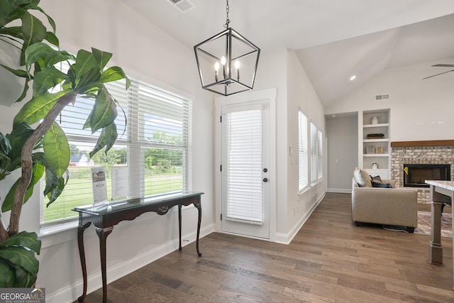 8 Hardin Ct Lot 16, Newnan, GA 30263 - foyer featuring lofted ceiling, wood finished floors, a chandelier, a brick fireplace, and baseboards
