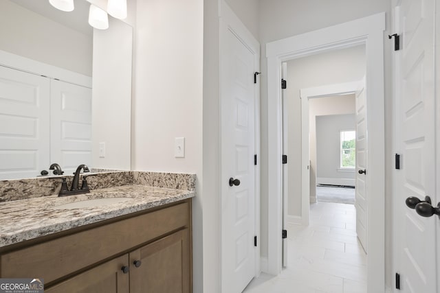 8 Hardin Ct Lot 16, Newnan, GA 30263 - bathroom with marble look tile flooring, vanity, and baseboards