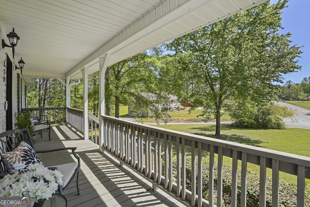 view of exterior entry with covered porch