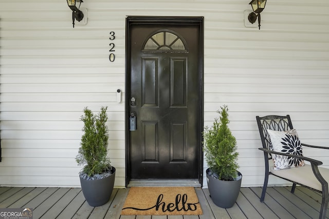 wooden terrace featuring a porch