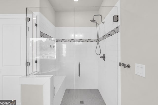 full bathroom featuring a stall shower