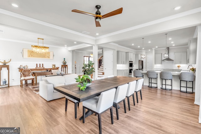 dining space with light wood-type flooring, a ceiling fan, and recessed lighting