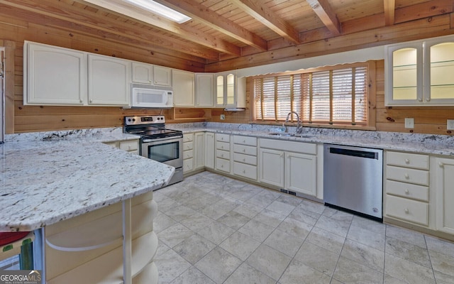 221 Laurel Cir, Dahlonega, GA 30533 - kitchen featuring wooden ceiling, a sink, light stone countertops, stainless steel appliances, and beamed ceiling