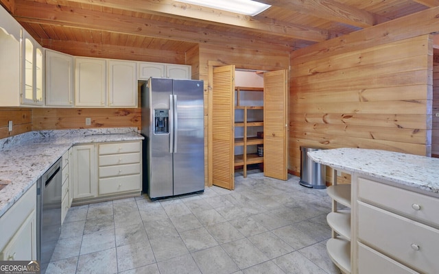 221 Laurel Cir, Dahlonega, GA 30533 - kitchen featuring beamed ceiling, wood walls, wood ceiling, and appliances with stainless steel finishes
