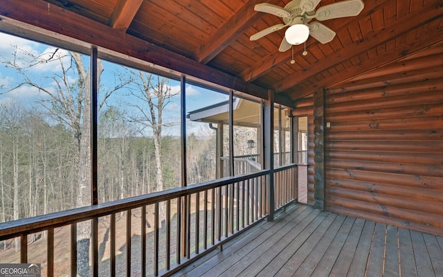 221 Laurel Cir, Dahlonega, GA 30533 - unfurnished sunroom with a forest view, beamed ceiling, and ceiling fan