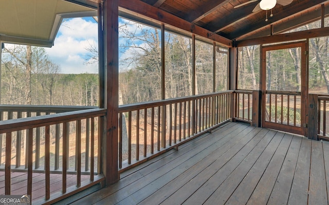221 Laurel Cir, Dahlonega, GA 30533 - unfurnished sunroom featuring a forest view, a ceiling fan, and beam ceiling