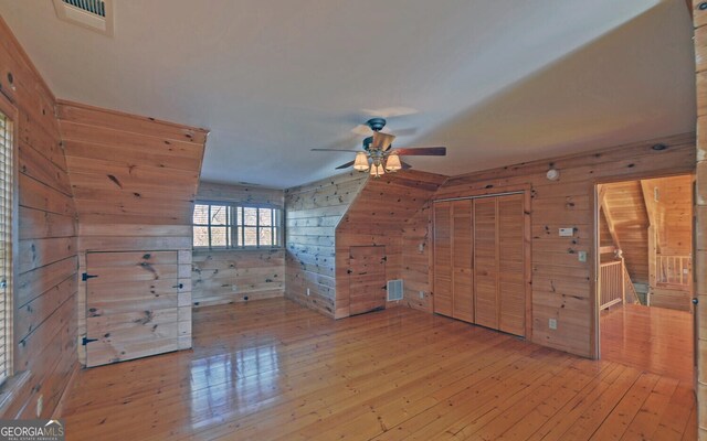 221 Laurel Cir, Dahlonega, GA 30533 - spare room with ceiling fan, visible vents, wood walls, and wood-type flooring