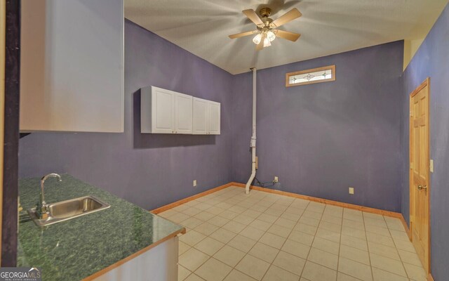 221 Laurel Cir, Dahlonega, GA 30533 - spare room featuring light tile patterned floors, baseboards, a sink, and a ceiling fan