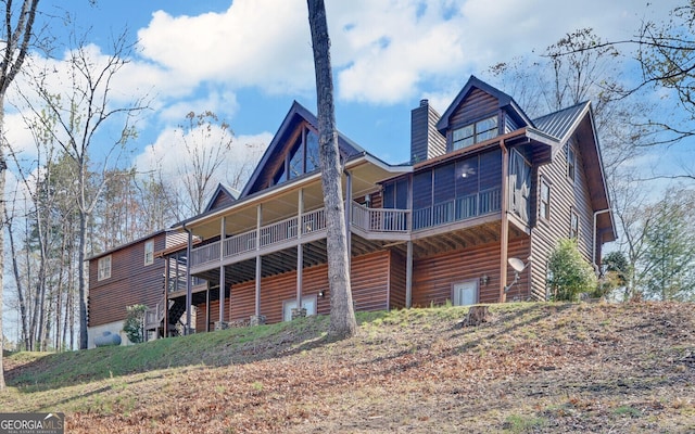 221 Laurel Cir, Dahlonega, GA 30533 - rear view of property featuring faux log siding and a chimney