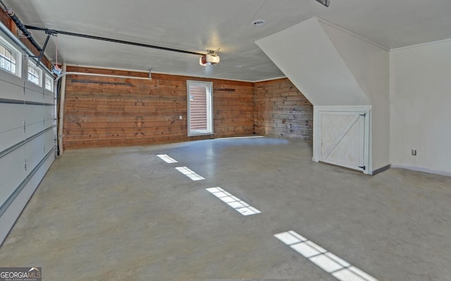 221 Laurel Cir, Dahlonega, GA 30533 - garage featuring wood walls and a garage door opener