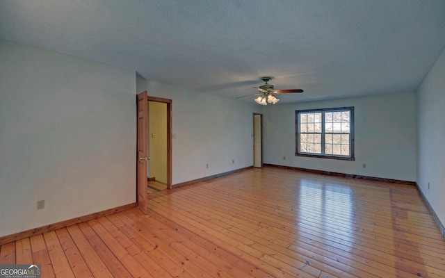 221 Laurel Cir, Dahlonega, GA 30533 - spare room with baseboards, light wood-style flooring, and a ceiling fan