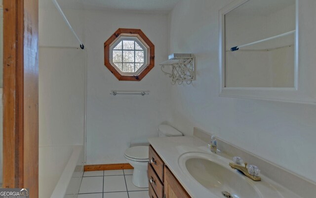 221 Laurel Cir, Dahlonega, GA 30533 - full bathroom featuring tile patterned floors, toilet, vanity, baseboards, and shower / bath combination