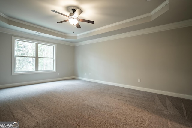 244 Meeler Cir, Bogart, GA 30622 - unfurnished room with a tray ceiling, dark colored carpet, crown molding, and a ceiling fan