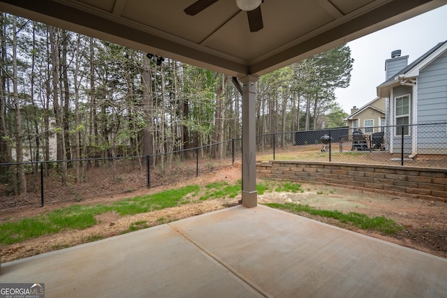 244 Meeler Cir, Bogart, GA 30622 - fenced backyard with ceiling fan and a patio area