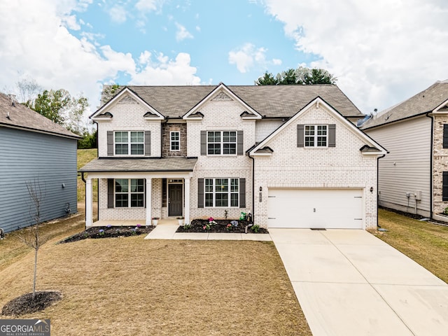 traditional home featuring brick siding, driveway, a front lawn, a porch, and an attached garage