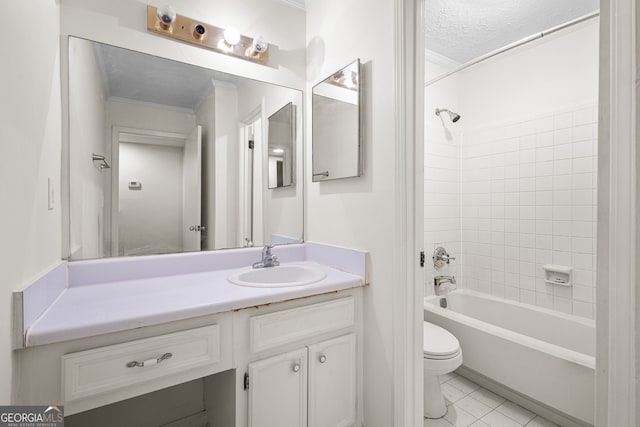 full bath with vanity, ornamental molding, tile patterned flooring, toilet, and washtub / shower combination