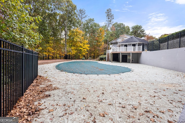 view of pool with a patio area, fence, and a fenced in pool