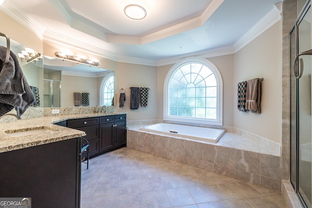 full bathroom featuring vanity, a tray ceiling, crown molding, tile patterned floors, and a stall shower