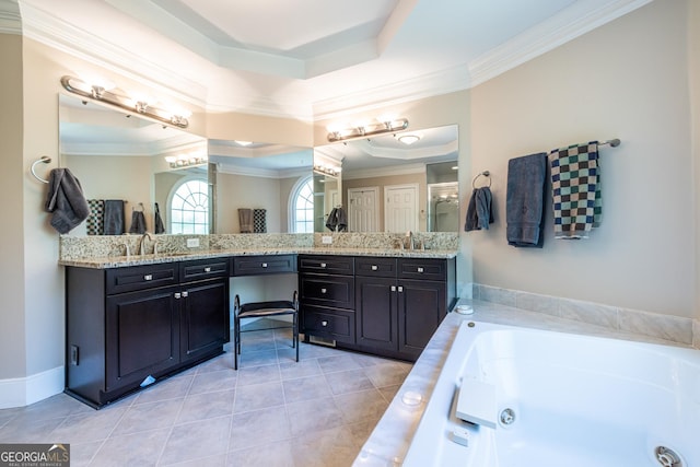 bathroom featuring ornamental molding, a tub with jets, vanity, a tray ceiling, and tile patterned flooring
