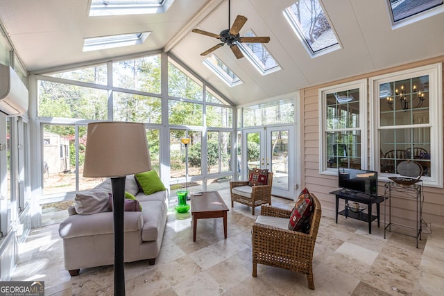 sunroom featuring a skylight, a ceiling fan, outdoor lounge area, expansive windows, and french doors