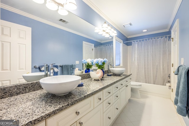 bathroom with visible vents, a sink, and double vanity