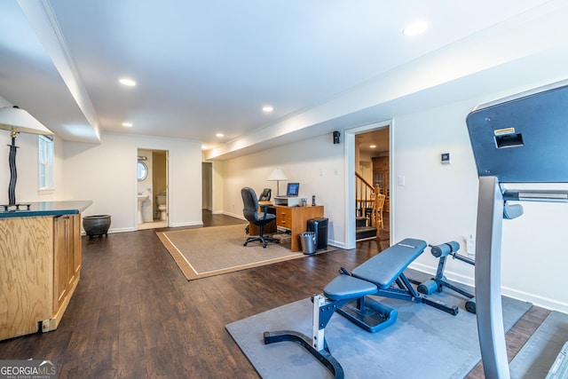 workout area with dark wood-style floors, baseboards, and recessed lighting