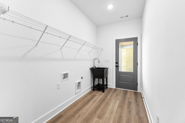191 Lagrange St, Newnan, GA 30263 - washroom featuring electric dryer hookup, wood finished floors, hookup for a washing machine, and baseboards
