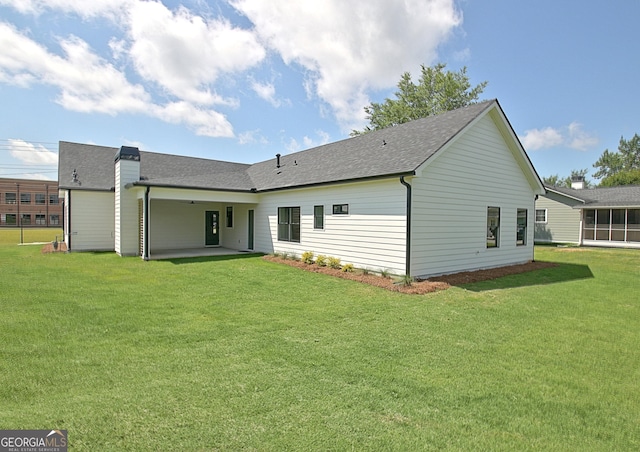 191 Lagrange St, Newnan, GA 30263 - rear view of property featuring a patio area, a yard, and roof with shingles
