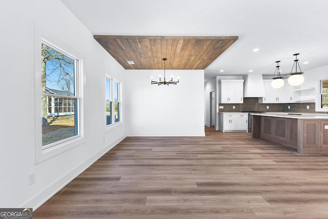 191 Lagrange St, Newnan, GA 30263 - kitchen featuring custom exhaust hood, a chandelier, open shelves, recessed lighting, and white cabinetry