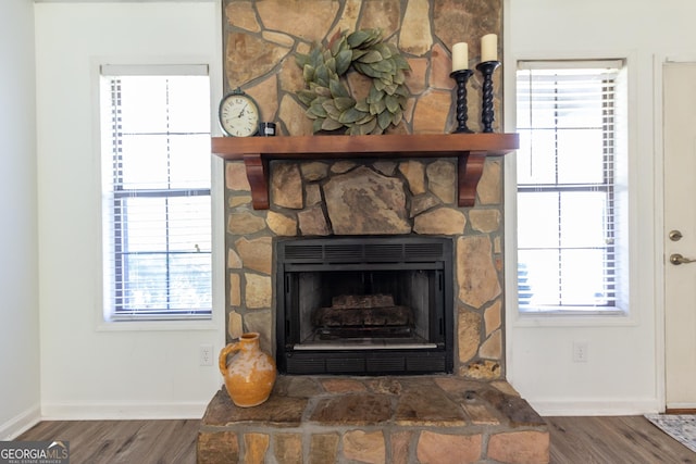 260 Peachtree Ln, Newnan, GA 30265 - detailed view of wood finished floors, baseboards, and a stone fireplace