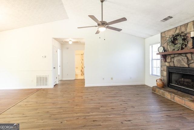 260 Peachtree Ln, Newnan, GA 30265 - unfurnished living room with lofted ceiling, a fireplace, wood finished floors, a ceiling fan, and baseboards