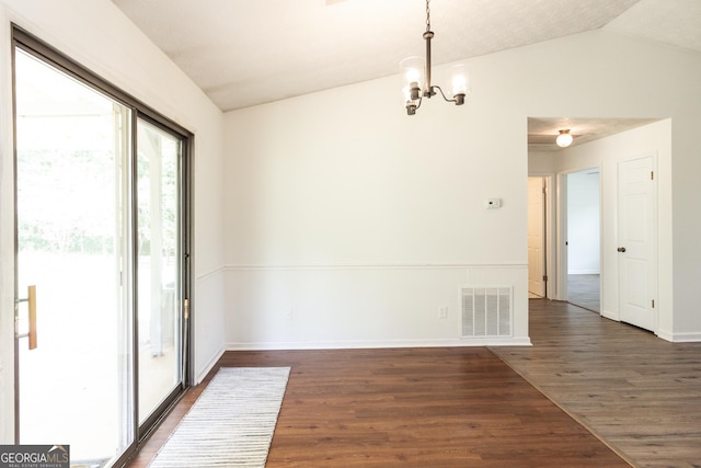260 Peachtree Ln, Newnan, GA 30265 - unfurnished dining area featuring a chandelier, dark wood-style flooring, vaulted ceiling, and baseboards