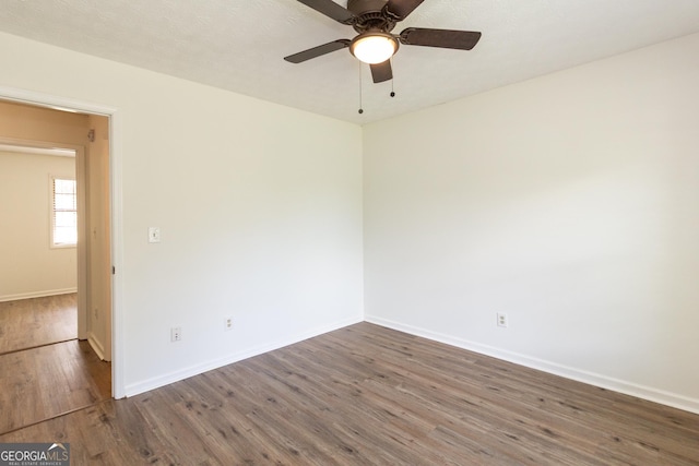 260 Peachtree Ln, Newnan, GA 30265 - unfurnished room with wood finished floors, a ceiling fan, and baseboards
