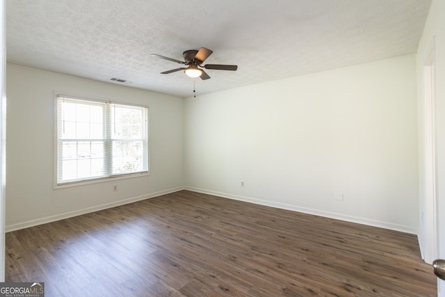 260 Peachtree Ln, Newnan, GA 30265 - empty room with a ceiling fan, dark wood-style flooring, baseboards, and a textured ceiling