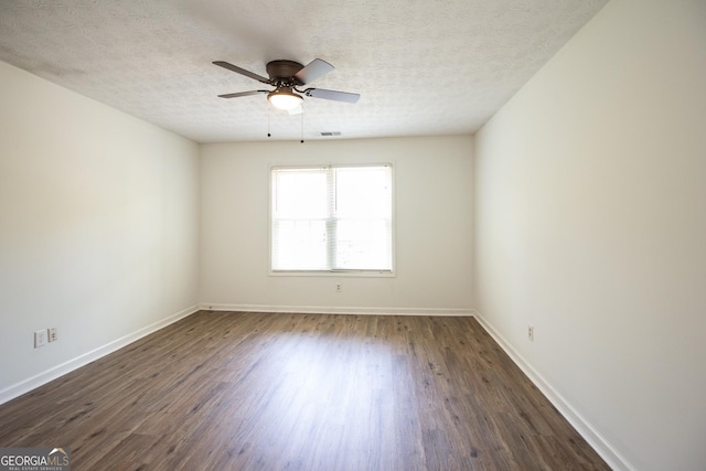260 Peachtree Ln, Newnan, GA 30265 - unfurnished room with dark wood finished floors, baseboards, ceiling fan, and a textured ceiling