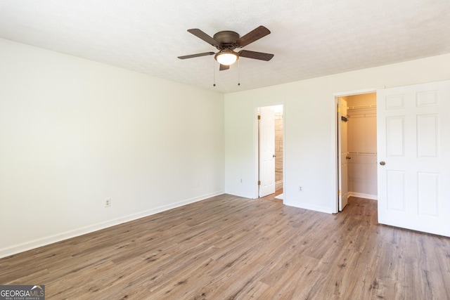 260 Peachtree Ln, Newnan, GA 30265 - unfurnished bedroom with a spacious closet, light wood-type flooring, baseboards, and a closet