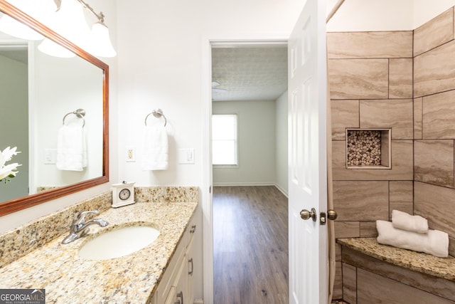 260 Peachtree Ln, Newnan, GA 30265 - bathroom featuring vanity, wood finished floors, and baseboards