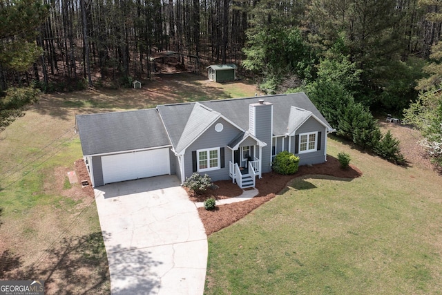 260 Peachtree Ln, Newnan, GA 30265 - view of front of property featuring concrete driveway, a garage, a front yard, a chimney, and a storage unit