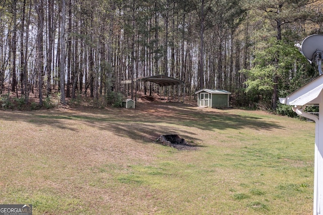 260 Peachtree Ln, Newnan, GA 30265 - view of grassy yard with a detached carport and a view of trees