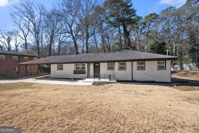 view of front of home featuring brick siding