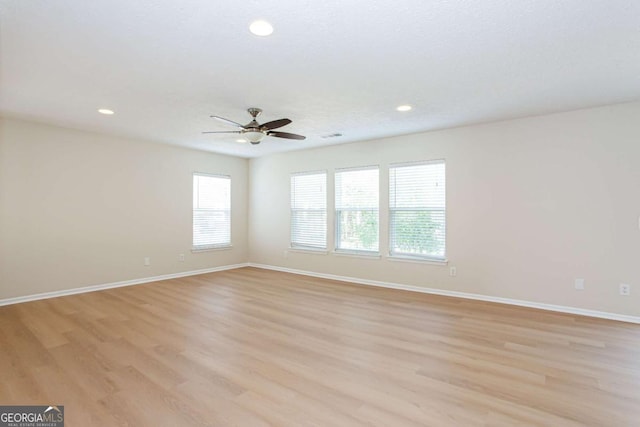 1924 Sweet Flag Rd, Lawrenceville, GA 30045 - spare room featuring light wood-style flooring, ceiling fan, baseboards, and recessed lighting
