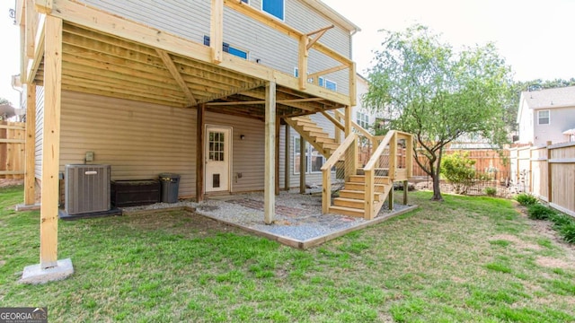 1924 Sweet Flag Rd, Lawrenceville, GA 30045 - back of house featuring central air condition unit, a wooden deck, and stairs